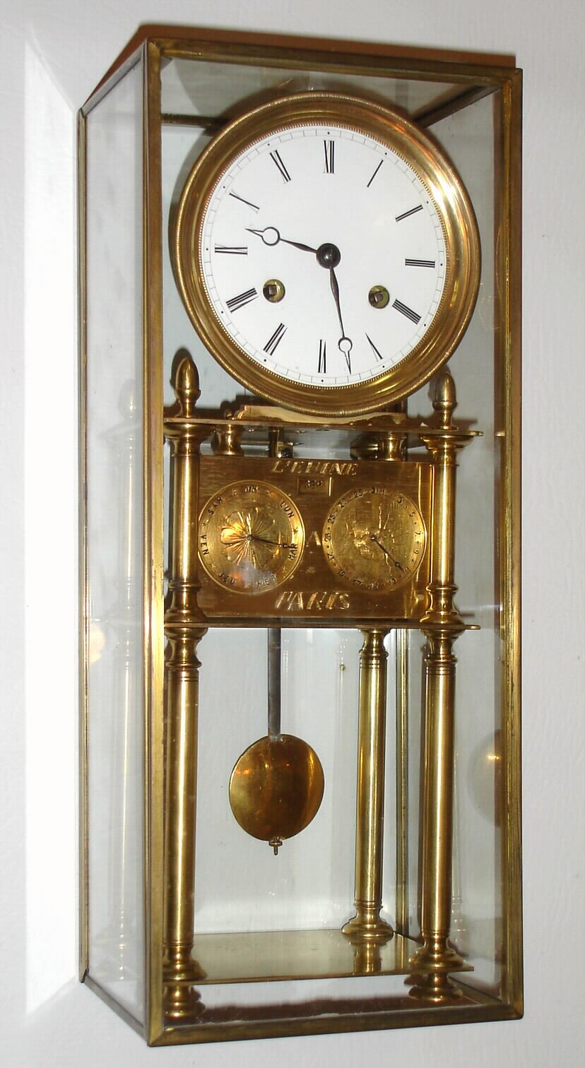 French skeleton clock, the c. 1820 spring powered time and strike movement with silk thread suspension, heavy molded brass bezel and white enamel dial, blued steel Breguet style hands, mounted to a later stand with calendar, bearing a spurious signature, covered with a purpose made, glazed rectangular dome with brass frame. — Antique Clocks Price Guide