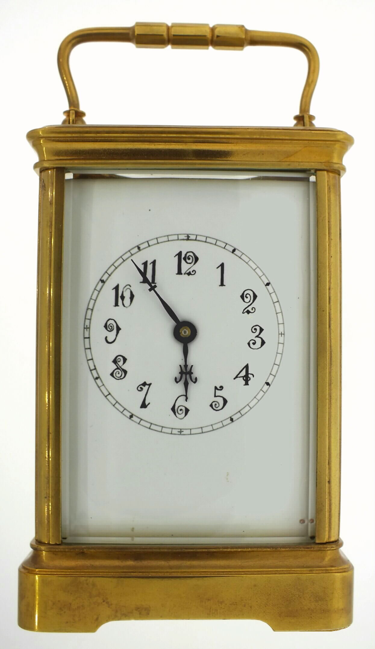 Boston Clock Co., Boston, Massachusetts, carriage clock, spring powered tandem winding time and strike movement, with gilt frosted time train plate, and fancy gilt bright polished and damascene back plate, signed Boston Clock Co., Boston Patd. Dec. 28 1880, striking the hours and half hours in passing, engraved balance and escape wheel cocks, cut bimetallic balance and blued steel balance spring, polished brass case, beveled glass sides and top, white enamel Arabic numeral dial, blued steel hands, c1885 — Antique Clocks Price Guide