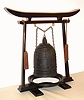 A rare and early Japanese bell clock (Tsurigane Dokei) within a finely cast bronze bell with Japanese characters and double headed dragon form handle; having a posted, iron, double spring driven, striking movement with crown wheel escapement and time regulated by a large circular balance with moveable double weights, originally for adjusting the temporal hours every day before each sunrise and sunset with the change of each Japanese season. The brass dial with single, fixed hand has traditional Japanese numerals 9 through 4 with applied silvered butterflies to the original surrounding dial plate. The rotating dial with adjustable "hour" and "half hour" markers is a common 19th Century upgrade to many very early Japanese clocks that have a single foliot or balance, since changing the weights and hence the rate before sunrise and sunset each day was extremely unhandy. This is verified by J. Drummond Robertson in The Evolution of Clockwork , page 226 saying "we find some of the old clocks "converted" to the new style of motion work. The old fixed hour circle with its revolving centre was removed and the new revolving circle and its fixed hand with adjustable "hour" plates was substituted." This is the case in each of the only other examples of Japanese Bell Clocks of which we are aware: see Japanese Clocks by N.H.N. Mody, plate 113, fig.1 for an almost identical example to the clock being offered. This dial conversion is also apparent in the Bronze Bell Clock sold at Sotheby's Masterpieces From the Time Museum Sale, Part Two, 19 June 2002, lot 126. An inscription on the bell reads Fukushima ya Katsutaro 1689, who may be the maker of either the clock or the bell. Most Japanese spring driven clocks have a fusee to the time train and a going barrel to the strike train. This movement is anomalous, in that is has two going barrels. It may be that the Japanese had not developed a method of turning a fusee at this early date, c1690