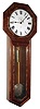 Seth Thomas Clock Co., Thomaston, Conn., "Regulator No. 18" wall clock, 8 day, time only, weight driven movement in well figured walnut case with painted metal dial and finely damascened pendulum bob, c1885