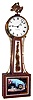 Elmer O. Stennes, Weymouth, Mass., "Banjo" wall clock, 8 day, time only, weight driven movement in an inlaid cross banded mahogany case with reverse painted throat and lower tablets, painted metal dial and brass eagle finial, dated 1972, #12 and stamped "M.C.I.P."