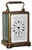 French carriage clock for J.E. Caldwell and Co., Philadelphia, 8 day, time only, spring driven movement in brass and beveled glass corniche style case, c1890 with associated leather travel case
