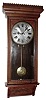Waterbury Clock Co., Waterbury, Conn., "Regulator No. 67" wall clock, 8 day, time only, two weight driven movement in a walnut case with embossed door and trim and painted metal dial, c1906