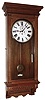 Waterbury Clock Co., Waterbury, Conn., "Regulator No. 54" wall clock, 8 day, time only, two weight driven movement in an oak case with embossed lower trim and painted metal dial, c1906