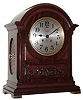 Chelsea Clock Co., Boston, Mass., "Mahogany Dome" mantel clock, 8 day, time and ship's bell strike, spring driven movement with lever escapement in a mahogany case with applied carving below dial and fret work sides set on square brass feet and 6" silvered metal dial, c1920 s#136079