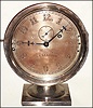 E. Howard and Co., Boston, Mass., "No. 69" marine or locomotive clock special order for the American Steam Gauge Company, 8 day, time only, spring driven movement with lever platform escapement in a nickel plated brass case on pedestal base with Arabic numeral nickel plated brass dial, c1863