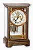 Waterbury Clock Co., Waterbury, Conn., "Toulon" brass and beveled glass 8 day, time and strike crystal regulator with exposed escapement, c1909