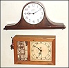 Clocks- 2 (Two) plug-in electrics: Seth Thomas Westminster Chime, 1965; Eli Terry reproduction box clock showing Dartmouth college, made in 1941 for Philip H. Hall.