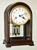 Waterbury Clock Co., Waterbury, Conn., "Marson" mahogany and beveled glass 8 day, time and strike crystal regulator, c1917