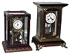 Clocks- 2 (Two) brass, glass and wood crystal regulators: French 8 day, time and strike; German 400-day; 20th century.