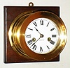 Waterbury Clock Co., Waterbury, Conn., "Ship's Bell No. 1" brass 8 day striking clock on wood, c1915