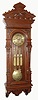 German, Gustav Becker, 3-weight, Grand Sonnerie "Vienna Regulator", with a fancy multi rod "faux-grid" pendulum, the dial center and pendulum with matched scroll engraving; weights with a different pattern, in a case of carved walnut and veneers, c1885