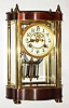 Waterbury Clock Co., Waterbury, Conn., "Brittany" gold plated and mahogany 8 day, time and strike crystal regulator, c1912