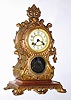 Waterbury Clock Co., Waterbury, Conn., "Clymer" gold plated cast metal 8 day, time and strike mantel clock, c1906