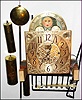Elliott, London, triple chime long case movement on wood seat board with silvered dial, 3 brass weights, pendulum, and 9 tube rack, c1900
