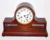 Waterbury Clock Co., Waterbury, Conn., "Jarnac" mahogany and beveled glass 8 day, time and strike mantel clock, c1900