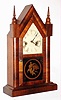 Waterbury Clock Co., Waterbury, Conn., "Sharp Gothic" mahogany 30 hour time and strike steeple clock, c1881