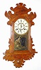 Waterbury Clock Co., Waterbury, Conn., oak 8 day, time and strike hanging gingerbread clock, c1891