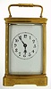Boston Clock Co., Boston, Massachusetts, carriage clock, spring powered tandem winding time and strike movement, with gilt frosted time train plate, and fancy gilt bright polished and damascene back plate, signed Boston Clock Co., Boston Patd. Dec. 28 1880, striking the hours and half hours in passing, engraved balance and escape wheel cocks, cut bimetallic balance and blued steel balance spring, polished brass case, beveled glass sides and top, white enamel Arabic numeral dial, blued steel hands, c1885
