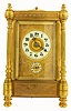 French carriage clock, large size, with grand petite sonnerie striking and alarm, repeating on demand, spring powered eight day movement with silvered lever platform escapement, strike and alarm on gongs, grand/ petite/ silence lever at bottom, polished brass columns style case with turned finials, feet and columns, fancy handle with similar turnings, engraved panels at top and base, rectangular beveled front, side, and back glasses, large round beveled glass in the top for viewing escapement, gilt dial mat with engraved decoration, white enamel dials with Arabic numerals, and blued steel hands. c1890