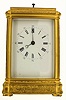 French carriage clock in a gilt Gorge case with foliate engraving, polychrome enamel scenes on copper panels showing rural landscapes which include people and buildings, beveled glass front and top for viewing the escapement, spring powered eight day, two train movement, striking the hours and half hours on a gong, repeating the hour on demand, Roman numeral white enamel dial with Arabic 5 minute markers, blued steel Breguet hands, c1870