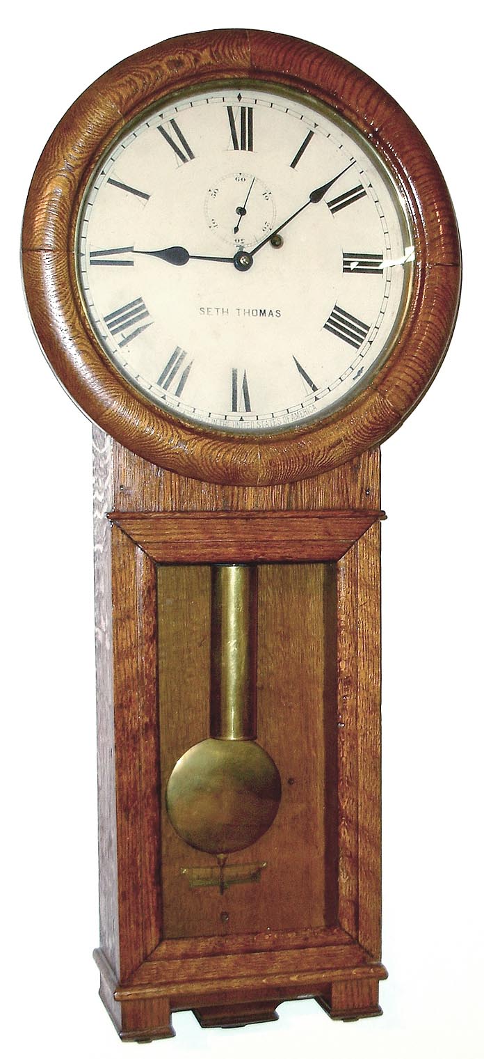 Seth Thomas Clock Co., Thomaston, Conn., "Regulator No. 2" wall clock, 8 day, time only, weight driven movement in an oak case with painted metal dial, c1890 — Antique Clocks Price Guide