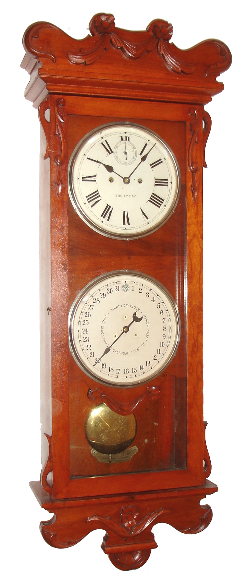 New Haven Clock Co., New Haven, Conn., "Austrian Calendar" wall clock, 30 day, time and calendar, spring driven movement in a cherry case with painted metal dials, c1900 — Antique Clocks Price Guide