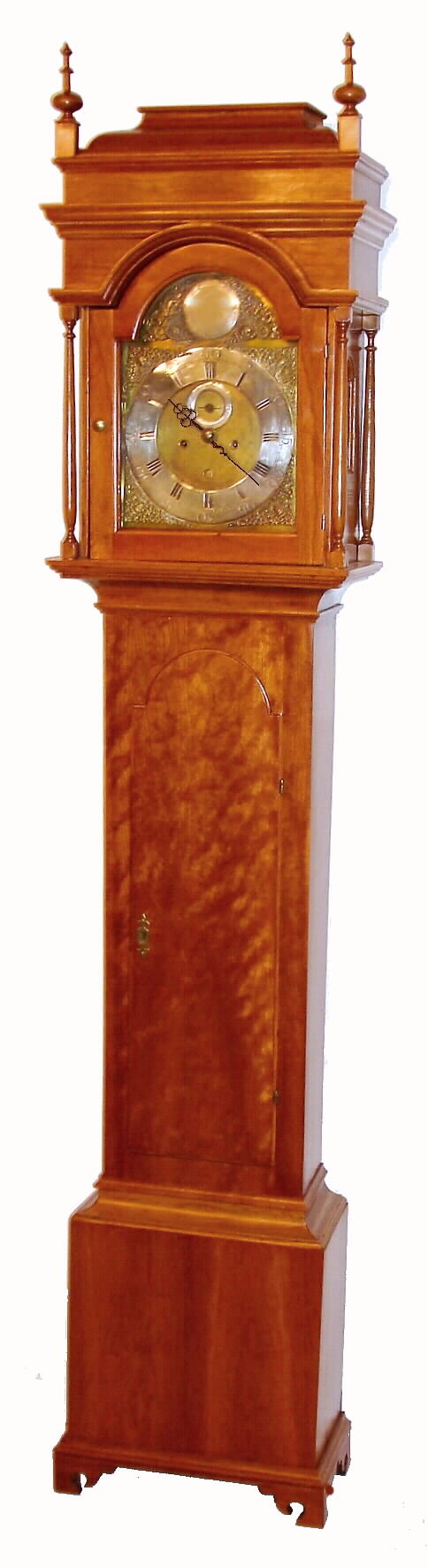 Aaron Miller, Elizabethtown, N.J. tall clock, 8 day, time and bell strike, weight driven movement with typical Miller wooden winding drums, arch cutout to lower section and clipped upper left corner of plates in gumwood case [stained cherry color]  with with brass dial, cast brass spandrels and silvered chapter ring, date aperture above 6 and disc with maker's signature in the arch, c1750 — Antique Clocks Price Guide