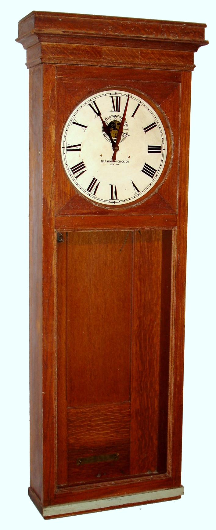 Self Winding Clock Co., New York, similar to the "Regulator 9-A" wall clock, time only, electrically wound spring driven movement in an oak case with painted metal dial, less pendulum s#176825, c1920 — Antique Clocks Price Guide