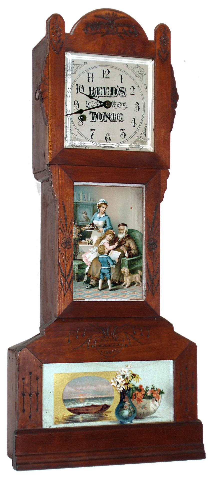 Yale Clock Co., New Haven, CT,  miniature eight day time only tall clock advertising Reeds Gilt Edge Tonic, movement unsigned, paper dial on zinc plate, blued steel hands, beveled glass in upper door, lower glass panels with lithographed cards, one a family scene, with Wishing You a Merry Christmas written at the bottom, the bottom illustrated with a painting, and vase and bowl with flowers, cherry case with incised decoration c1890 — Antique Clocks Price Guide