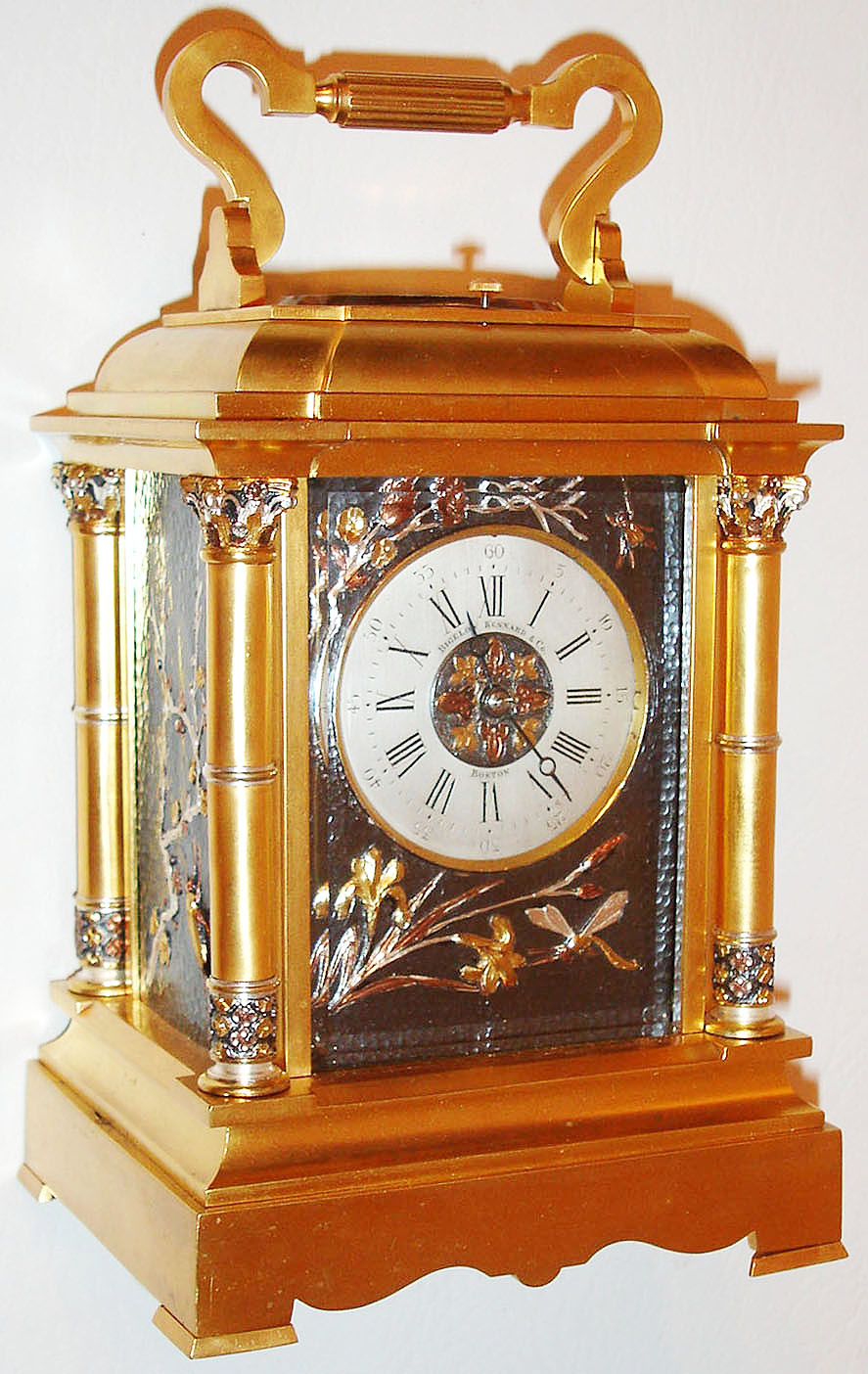 France, for Bigelow, Kennard and Co., carriage clock, gilt brass Anglaise Riche variant case with Corinthian columns, the capitals and bases with patinated silver and multicolor gold ornament, panels, dial center and dial mask with dark patinated ground with foliate and insect decoration in the Japanesque style, silvered Roman numeral dial signed Bigelow, Kennard and Co. Boston, blued steel Breguet style hands, eight day grand sonnerie movement with lever platform. — Antique Clocks Price Guide