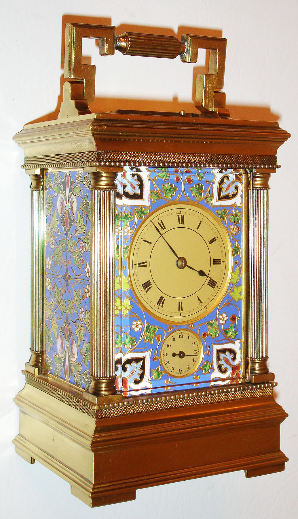 France, eight day hour repeating time, probably strike and alarm carriage clock, Anglaise Riche case with very nice champleve enamel panels, the foliate design in bright blues, greens, and reds, beveled glass in back door and top, matte gilt Roman numeral dial, blued steel hands, movement with silvered lever platform, c1880 — Antique Clocks Price Guide