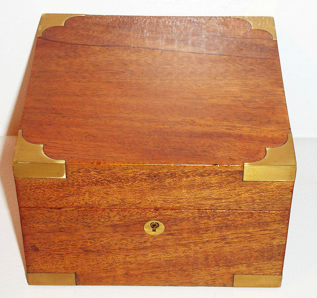 Zenith, Switzerland, marine chronometer, the weighted brass bowl in gimbals with two day, rim winding movement with lever escapement, balance with locking lever, matte silver Arabic numeral dial with up/ down indicator, signed Cronometre Zenith, plaque inside box lid similarly signed, blued steel hands, mahogany box with brass hardware, c1920 — Antique Clocks Price Guide