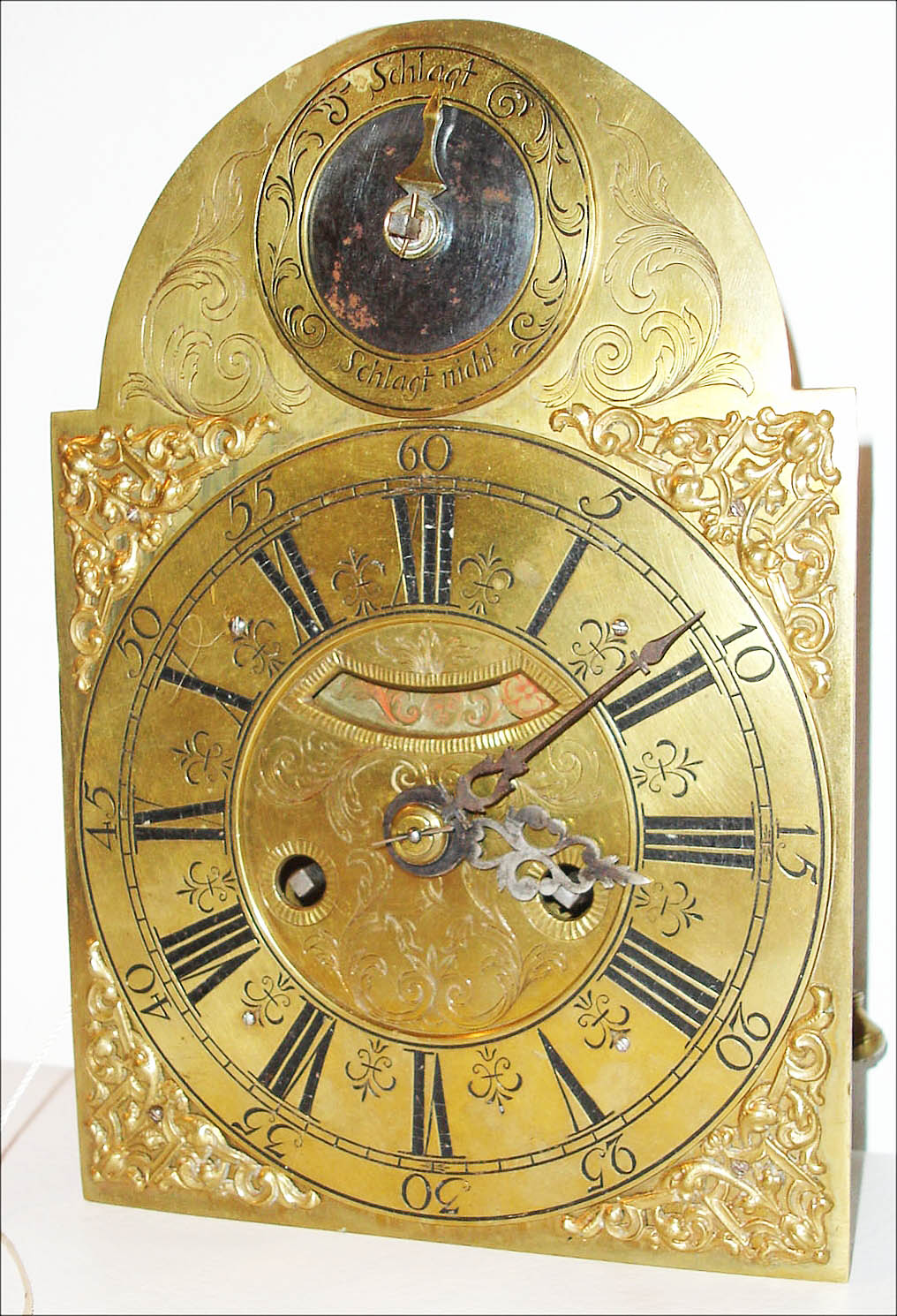 Austria, miniature quarter striking and repeating bracket clock movement with verge escapement, probably of two day duration, time side with fusee, strike with going barrel, strike and repeat on a single bell, back plate with engraving, baluster shaped pillars, brass composite dial with Roman numerals, Arabic five minute markers, and engraved decoration, mock pendulum displayed below 12, strike/ night strike indicator in arch, steel hands, c1770 — Antique Clocks Price Guide