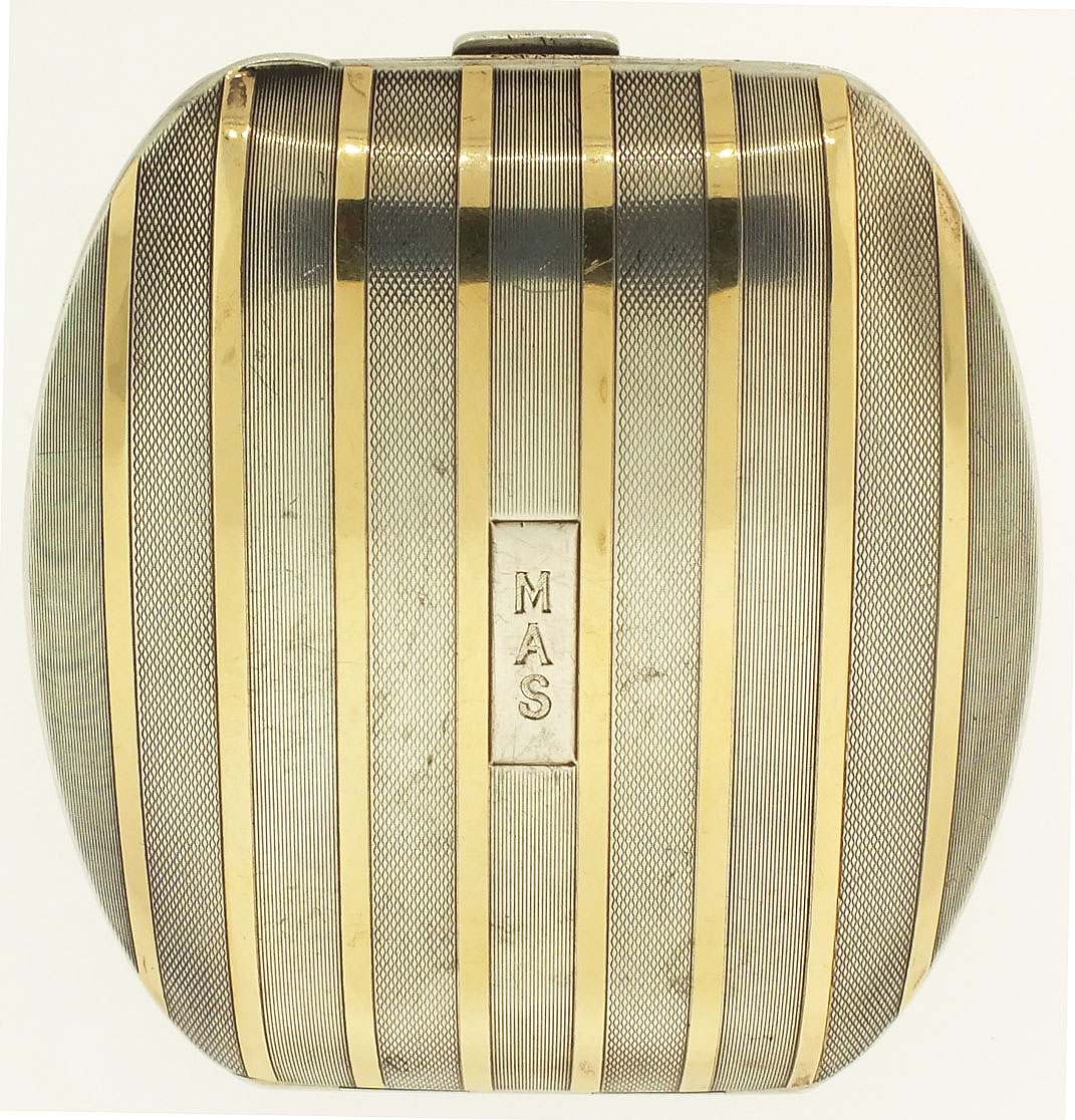 Octavia Watch Co., Switzerland, travel clock, 15 jewels, stem wind and set, 2 adjustments, straight line damascened 8 day, nickel plate movement, with lever escapement and cut bimetallic balance in a folding, sterling silver and 14k gold case, with straight line engine work and monogrammed cover, and Arabic numeral, single sunk, white enamel dial, and blued steel hands, W 75mm  L 85mm, c1925, 211g TW — Antique Clocks Price Guide