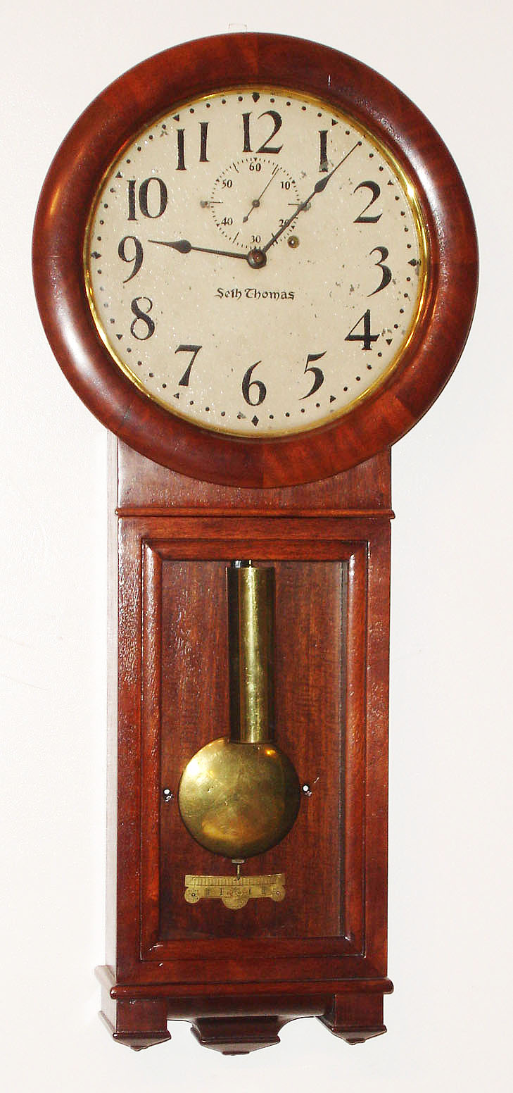 Seth Thomas Clock Co., Thomaston, Conn., "Regulator No. 2" wall clock, 8 day, time only, weight driven movement in a mahogany case with painted metal dial, c1885 — Antique Clocks Price Guide