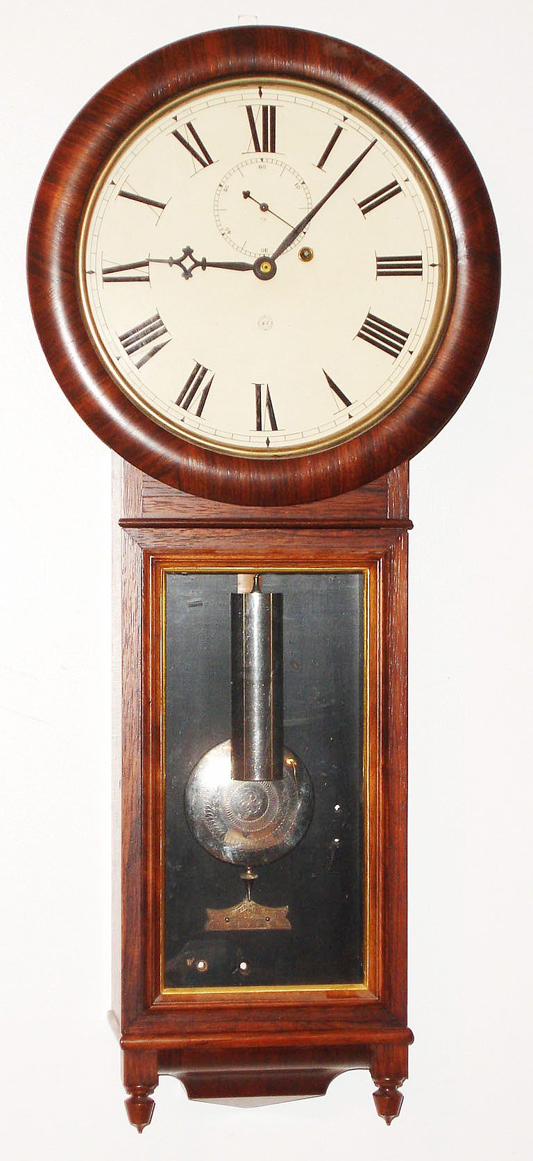 Seth Thomas Clock Co., Thomaston, Conn., "Regulator No. 1" wall clock, 8 day, time only, weight driven movement in a rosewood veneer case with painted metal dial and nickel damascene pendulum bob and nickel weight, c1886 — Antique Clocks Price Guide