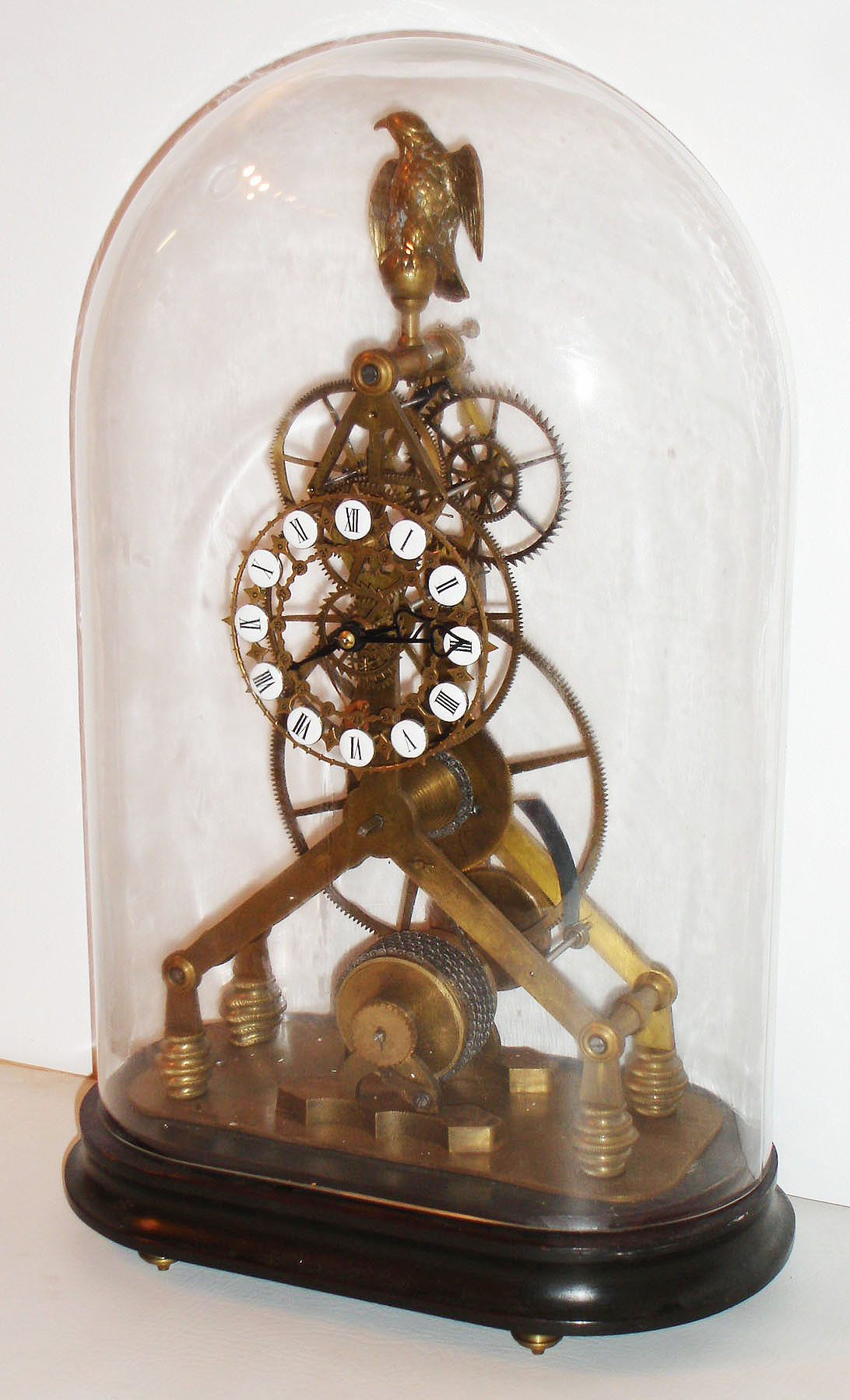 Reproduction modern Asian skeleton timepiece with fusee and oversize great wheel oval glass dome, late 20th century — Antique Clocks Price Guide