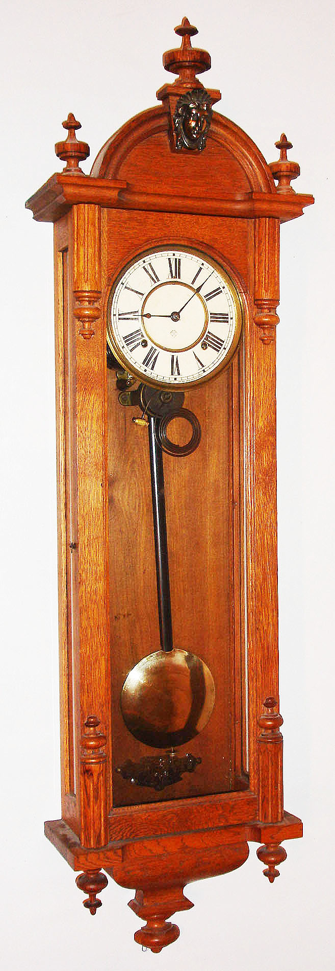 Ansonia Clock Co., New York, NY, "Capitol" wall clock, 8 day, time and strike, spring driven movement in an oak case with paper dial, c1900 — Antique Clocks Price Guide