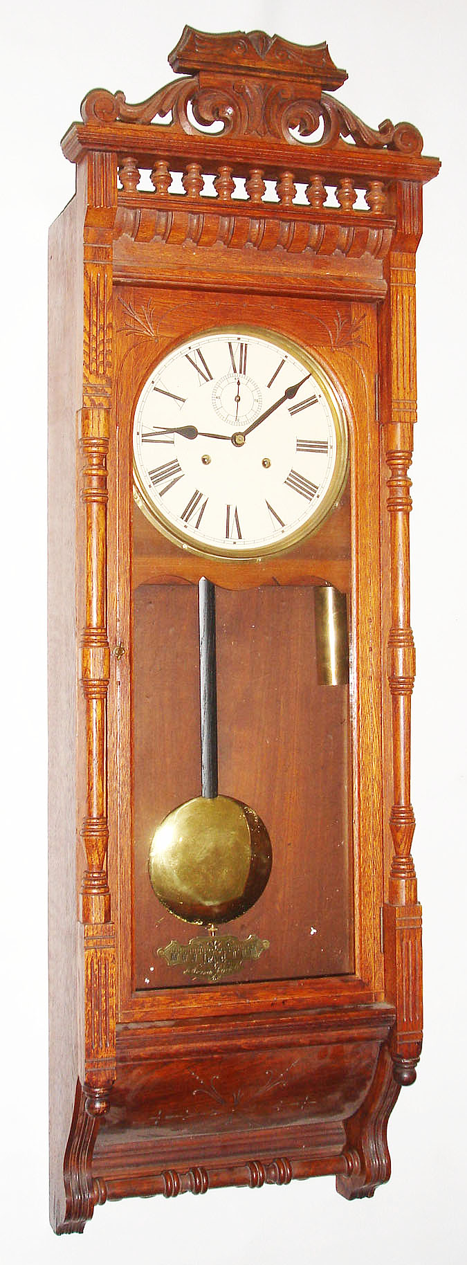 Ansonia Clock Co., New York, NY, "Santa Fe" wall clock, 8 day, time only, two brass weight driven movement in an oak case with painted metal dial, c1904 — Antique Clocks Price Guide