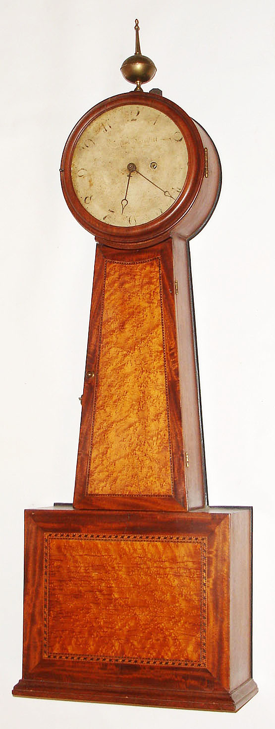Charles Babbitt, Taunton, Mass., "Shelf Banjo" clock, 8 day, time only weight driven movement in a mahogany case with bird's eye maple panels in hinged throat door and base and painted metal dial, c1820 — Antique Clocks Price Guide