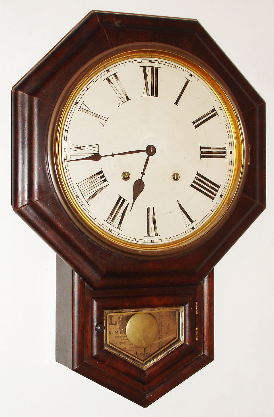 E.N. Welch Mfg. Co., Forestville, Conn., "No. 1 Drop Octagon" wall clock, 8 day, time and strike, spring driven movement in a rosewood case with painted metal dial, c1889 — Antique Clocks Price Guide