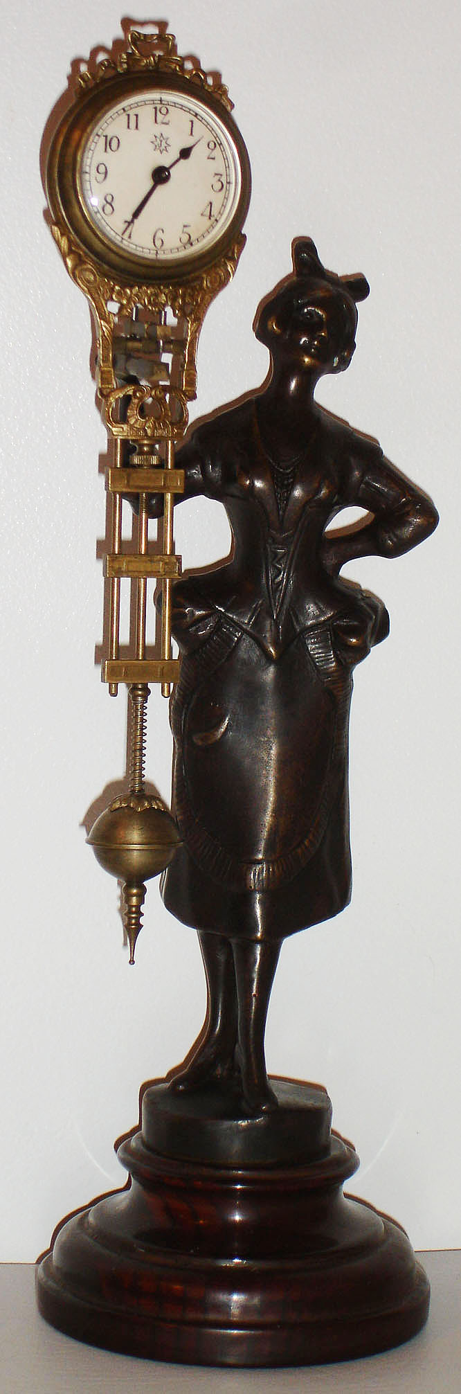 Reproduction miniature 30 hour swinger with bronzed figure on turned wood base, contemporary — Antique Clocks Price Guide