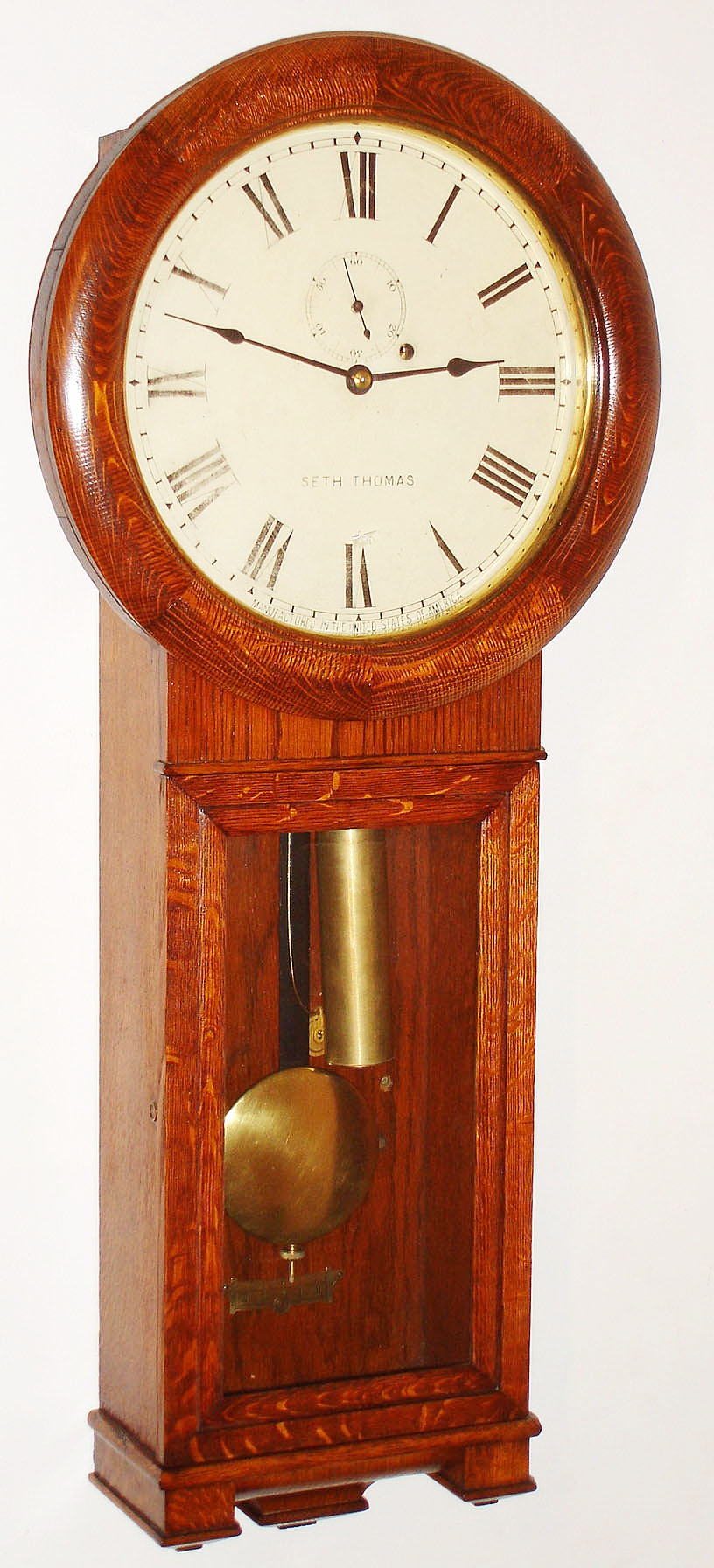 Seth Thomas Clock Co., Thomaston, Conn., "Regulator No. 2" oak, 8 day, time only, weight driven wall clock, 1908 — Antique Clocks Price Guide