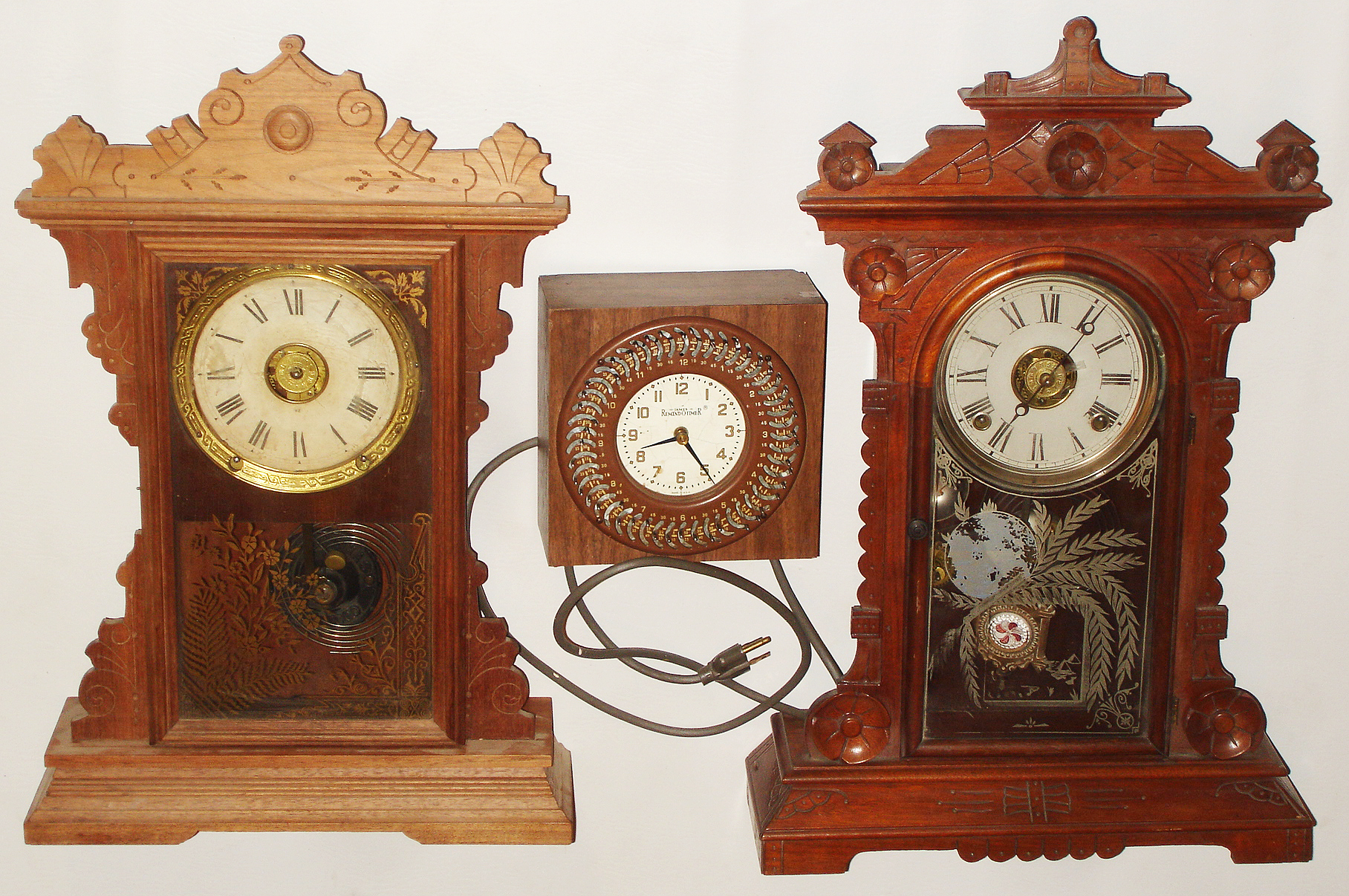Clocks- 3 (Three):  E.N. Welch "Hatton" mahogany, 8 day, time and strike, parlor clock; Seth Thomas Clock Co., Thomaston, Conn., "Dover" oak, 8 day, time and strike, kitchen clock; James "Remindotimer" electric; 19th &amp;n 20th centuries — Antique Clocks Price Guide