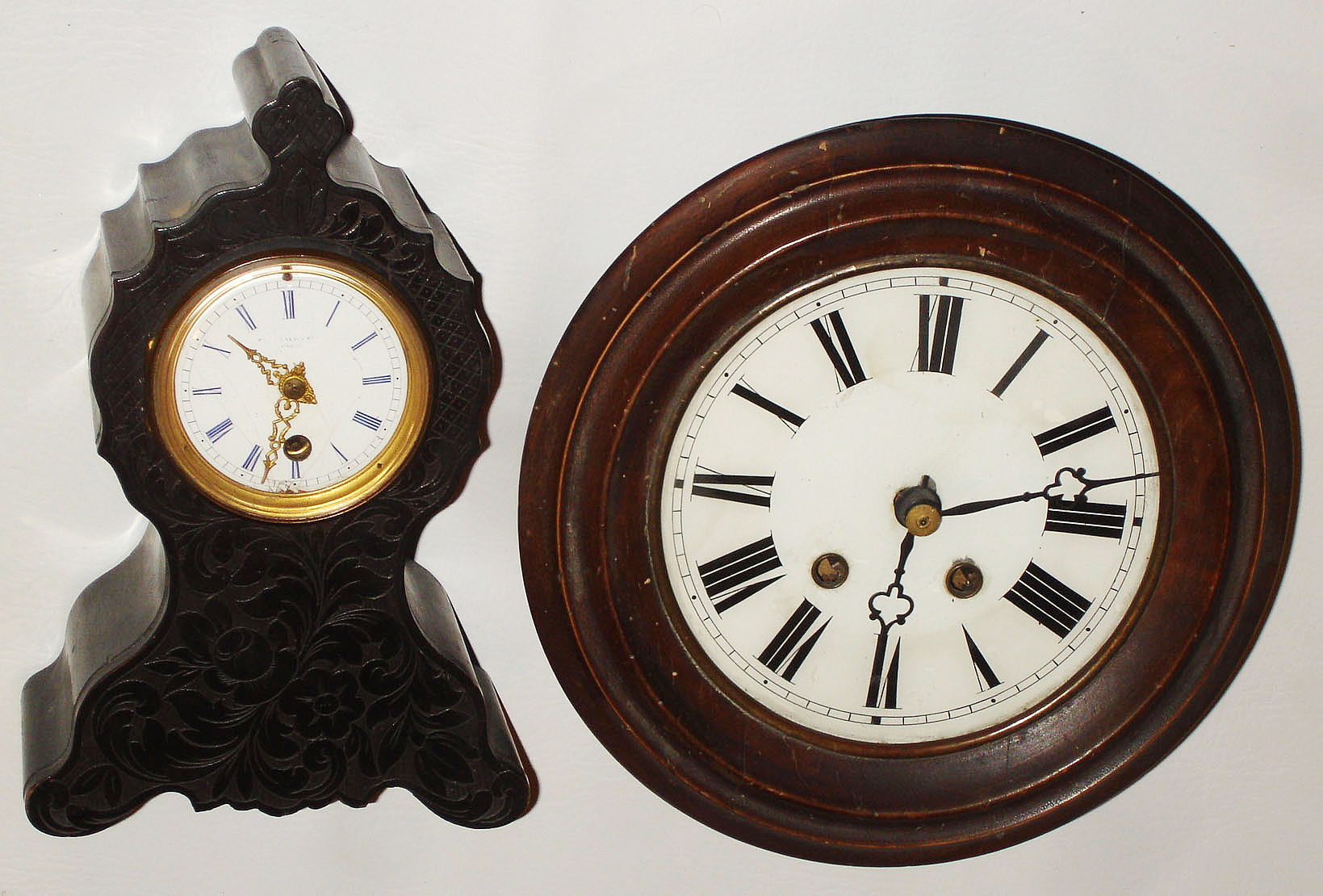 Clocks- 2 (Two): French ebonized, 8 day, time only, mantel clock; German wood, 8 day, time and strike, wag-on-wall; later 19th century — Antique Clocks Price Guide