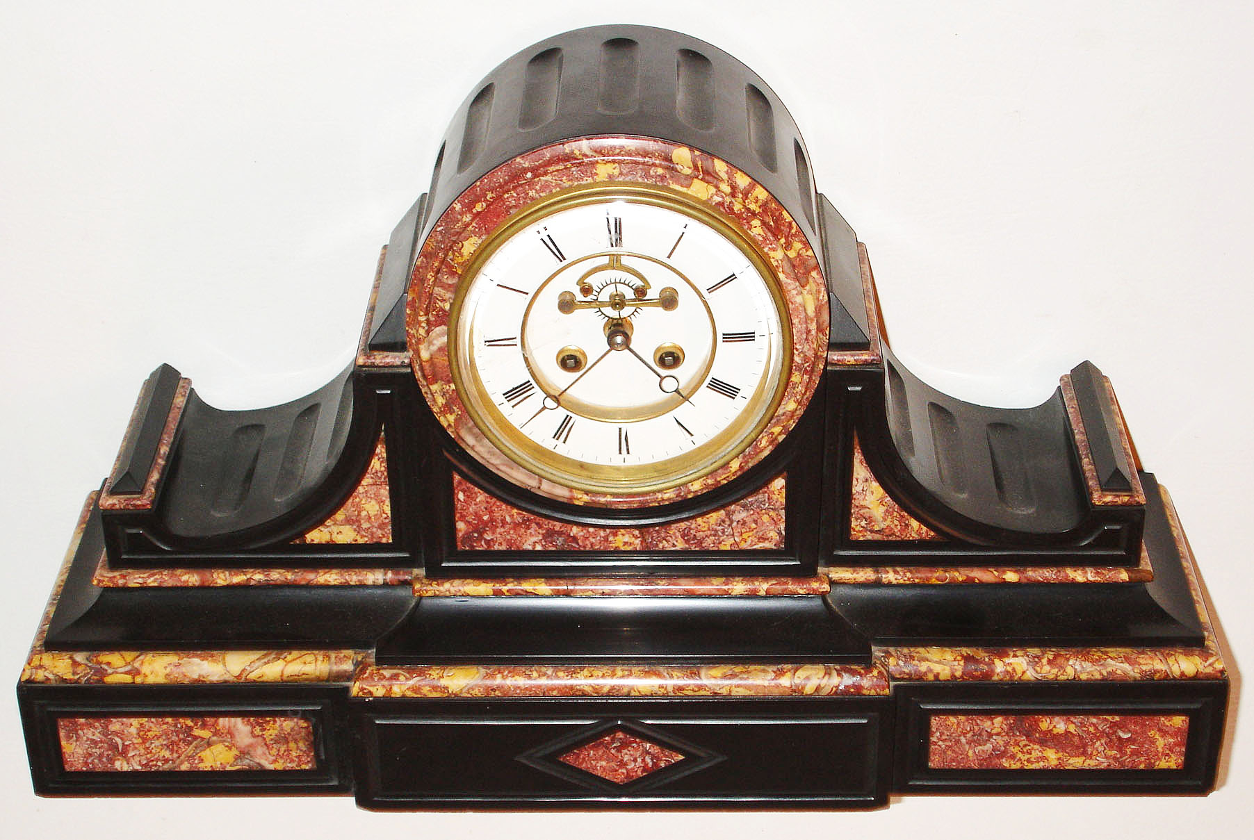 France, large Belgian slate drumhead style mantel clock with multi colored marble moldings and panels, white enamel Roman numeral dial with blued steel Breguet style hands, eight day time and strike pendule a Paris movement with Brocot open escapement, c1880 — Antique Clocks Price Guide