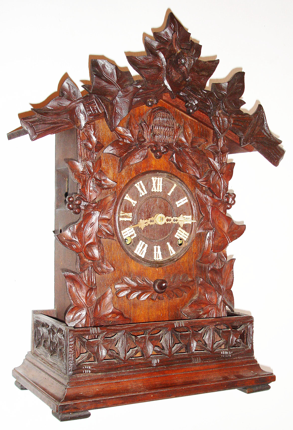 A. Frankfeld and Co., shelf cuckoo with Waterbury, 8 day, time and strike, movement, signed "A. Frankfeld and Co. Pat. April 24, 1866", the case with ivy, acorn, oak leaf and deer head carvings in the manner of the Black Forest clocks it copies, original bird and bellows, wooden Roman numeral dial with carved bone hands c 1870 — Antique Clocks Price Guide