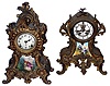 Clocks- 2 (Two) American, 8 day, time and strike, cast metal mantel clocks with porcelain panels: Gilbert "Nugget" with outside escapement; Ansonia "Amphion"; c1913 and 1904