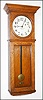 E. Howard and Co., Boston, Mass., for L.A. Fewkes, Boston, "Special Order" wall clock, 8 day, time only, weight driven movement stamped "E. Howard and Co. Boston" and "L.A. FEWKES BOSTON Mass.SS. 1900" with #70 stamped weight in an oak case with painted iron dial signed "E. HOWARD and CO. BOSTON" and standard Howard type brass damascened pendulum bob, c1900